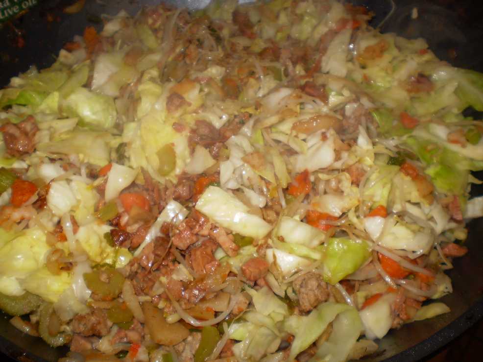 frying egg roll filling in wok